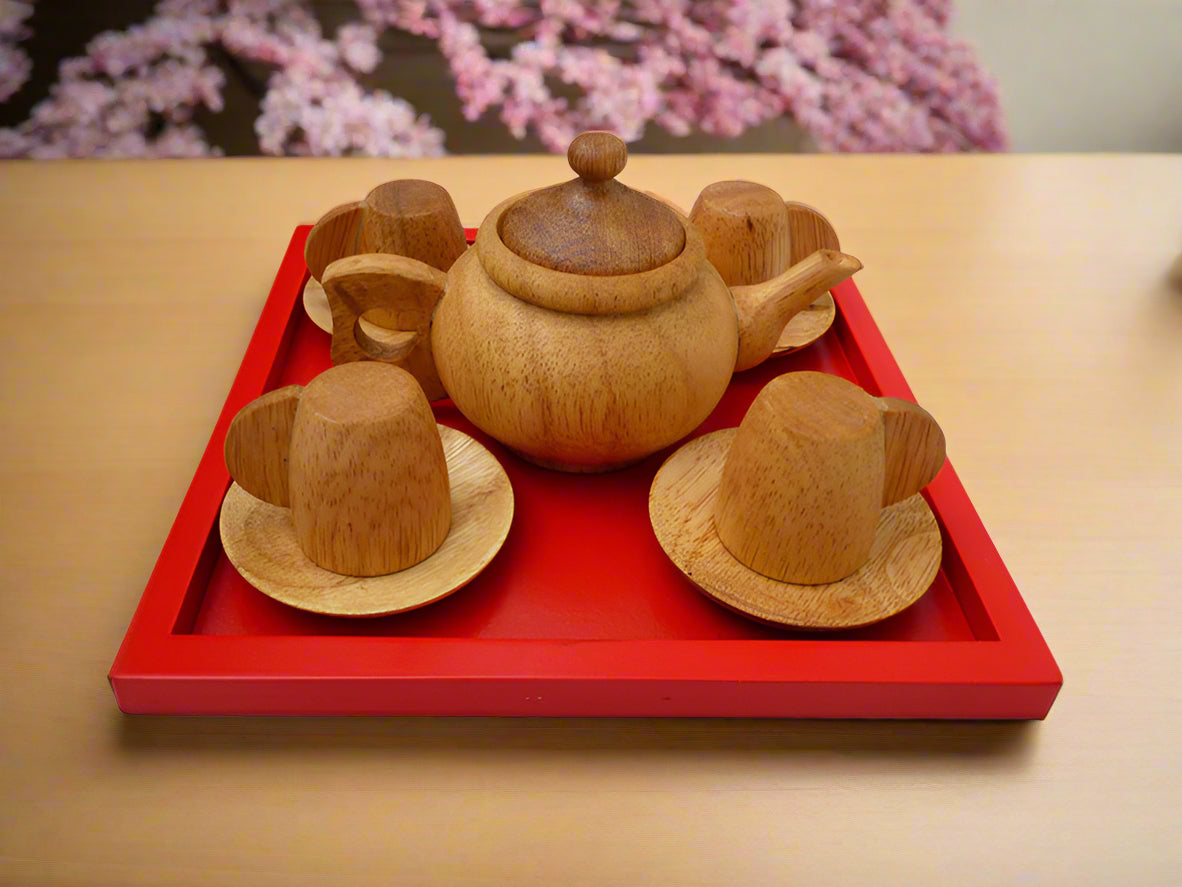 QToys japanese wooden tea set with teapot, cups, and saucers on a red tray against a white background
