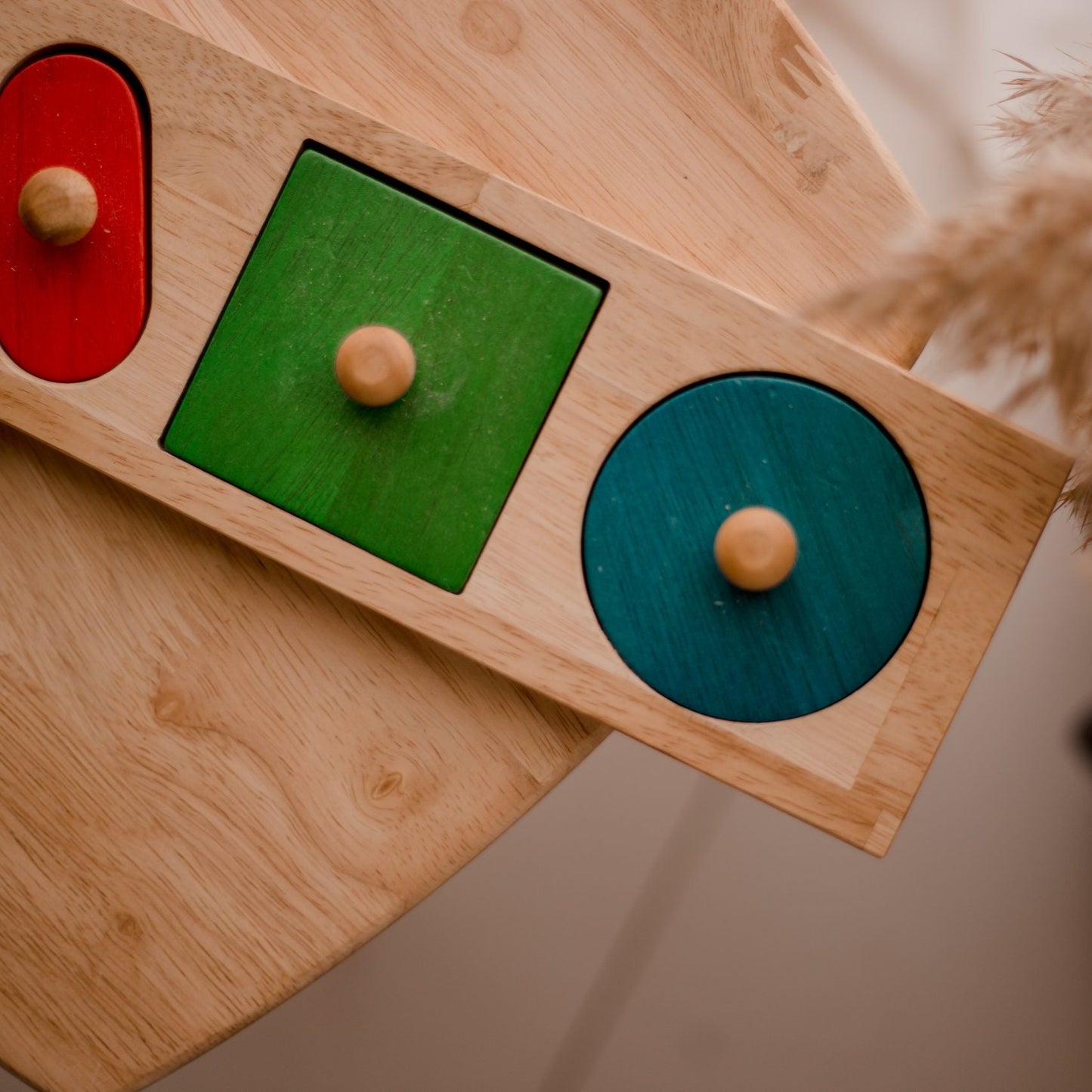 QToys Giant Shape Knobbed Puzzle - Wooden Montessori toy, on a table.