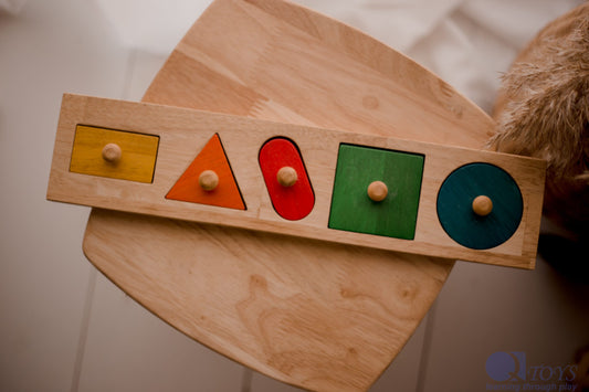 QToys Giant Shape Knobbed Puzzle - Wooden Montessori toy, on a table. 